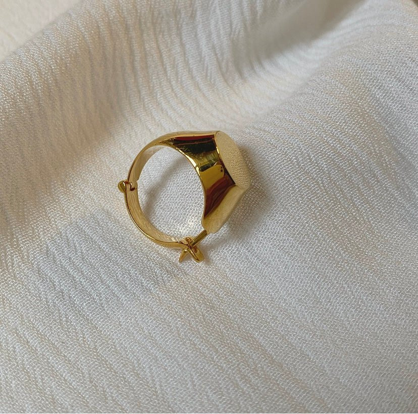 Gold-plated ABDUL earring transitioning between ring and earring, designed in Tbilisi for minimalist versatility.