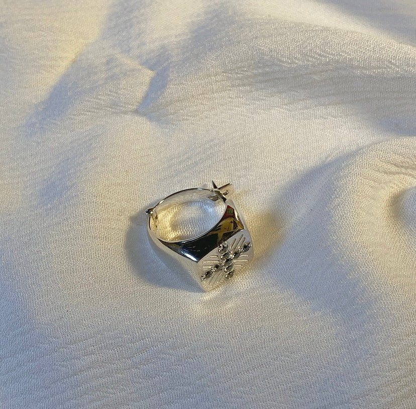 Front view of JAMAL Sterling Silver Ring-Shaped Earring with Swarovski crystals, designed by Giorgi Wazowski in Tbilisi, Georgia.