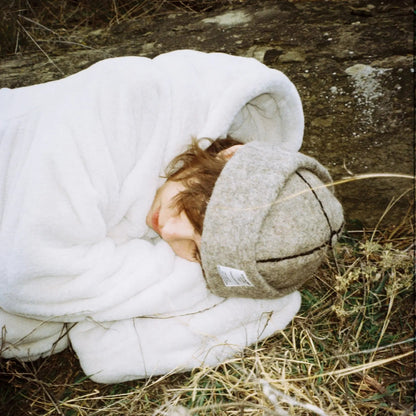 Mariam wears Dust wool felt hat by Giorgi Wazowski