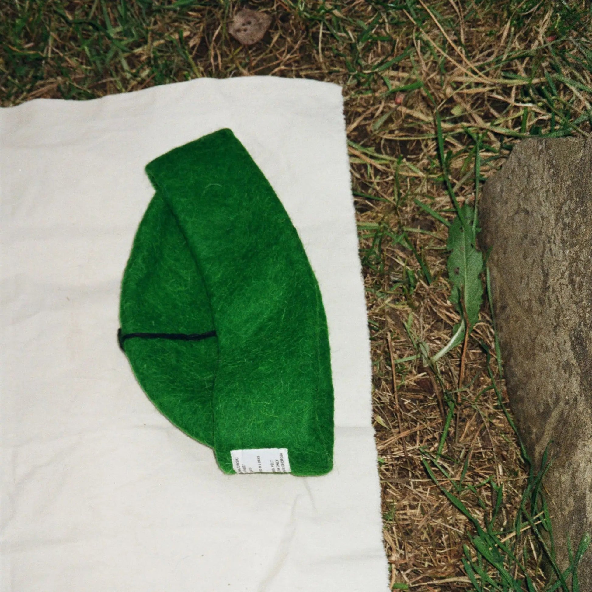 Folded Forrest wool felt hat, featuring earthy green tones and premium craftsmanship