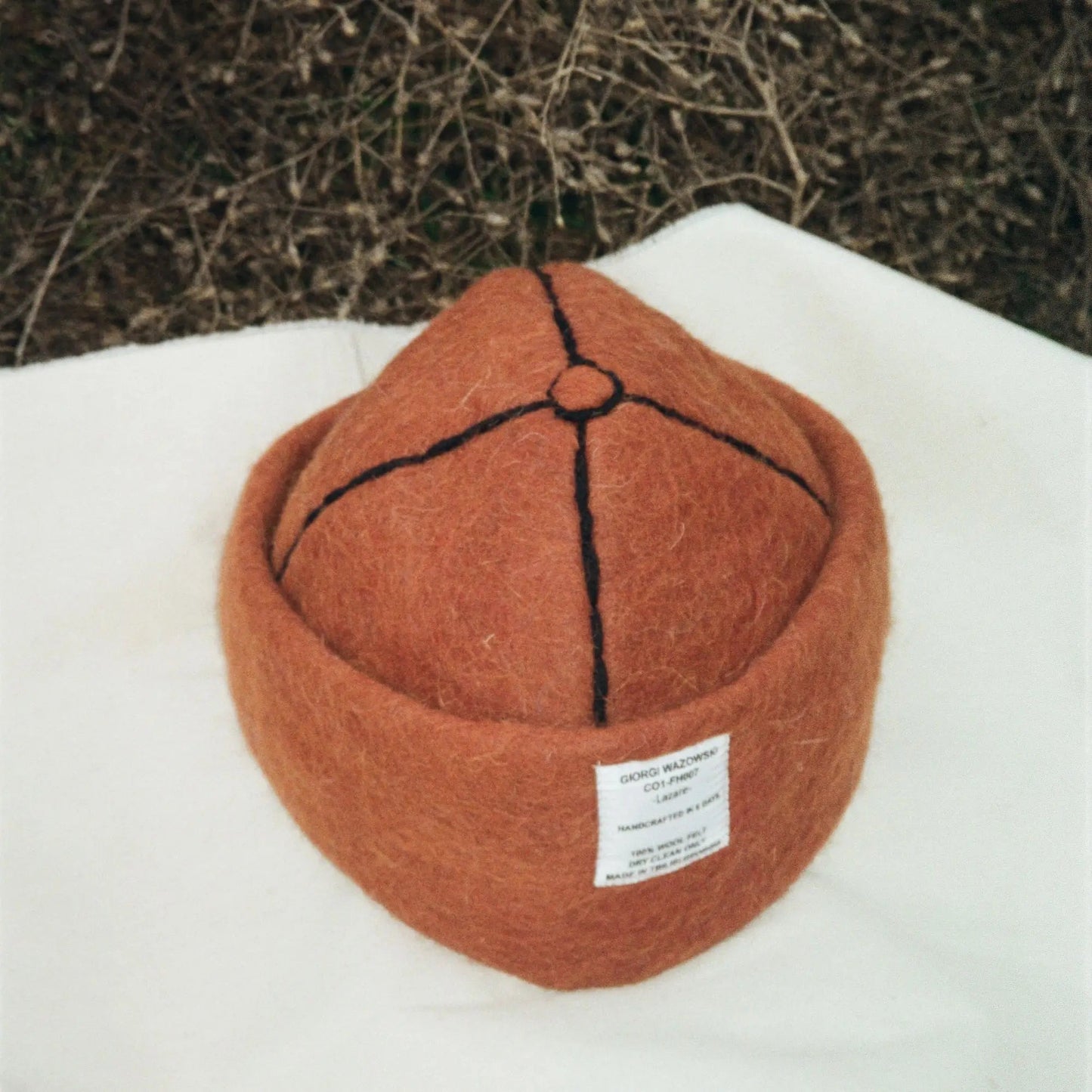 Detailed view of Mocha hat’s wool texture and label design