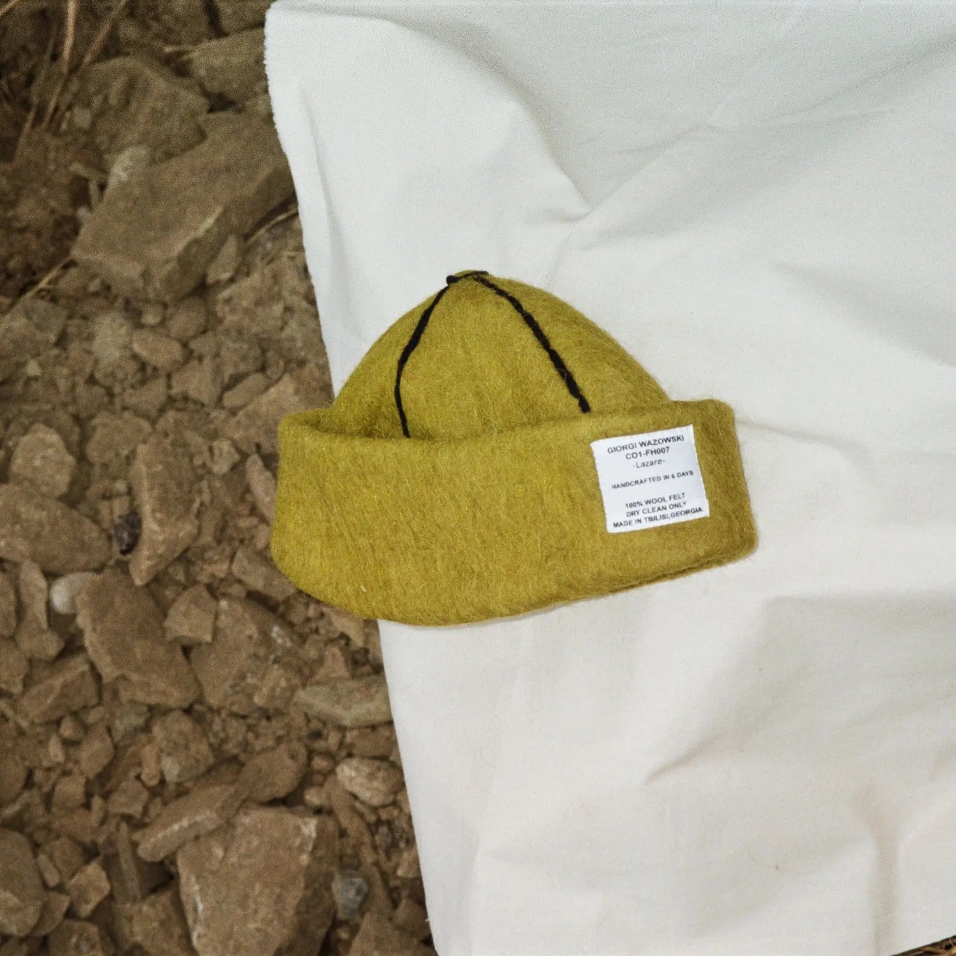 Folded Mustard wool felt hat, featuring bold color and soft 100% natural wool