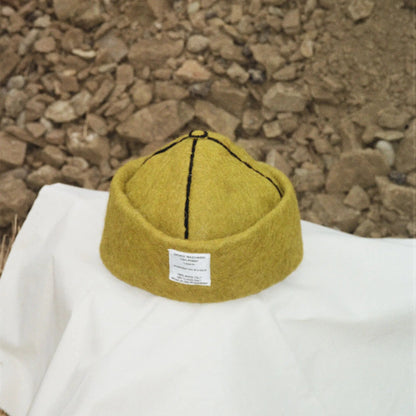 Mustard wool felt hat with black stitching, handcrafted from 100% wool