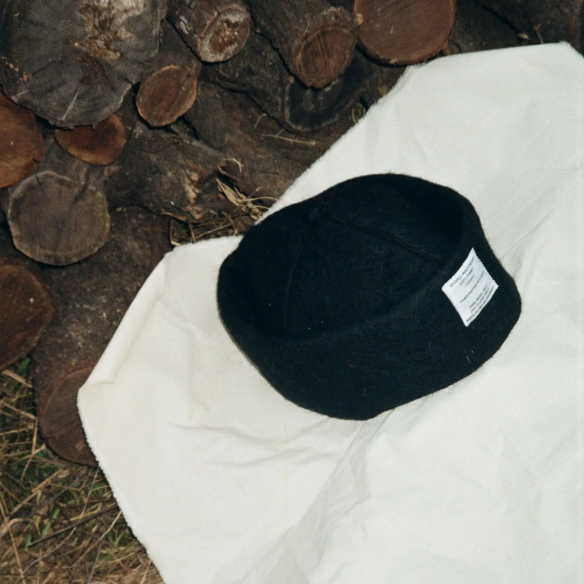 Close-up of Obsidian hatâ€™s wool texture and cross-stitch details