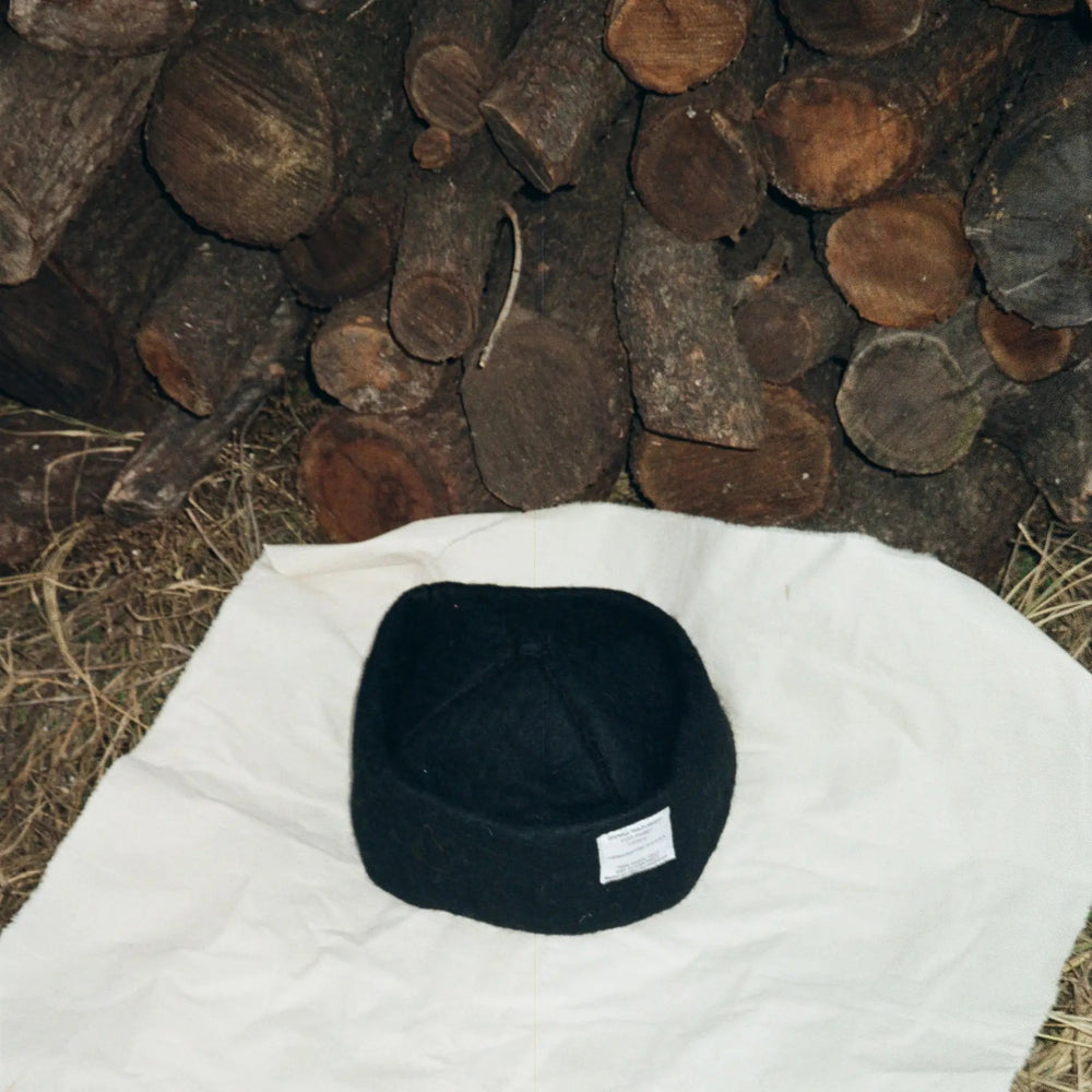 Detailed view of Obsidian hatâ€™s stitching and wool craftsmanship