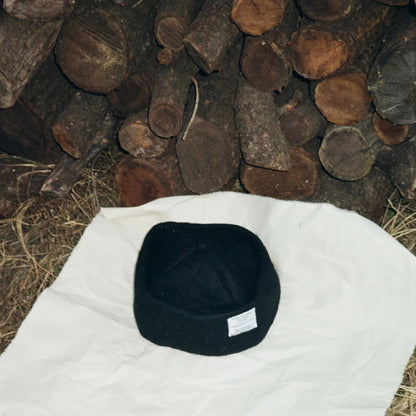 Detailed view of Obsidian hat’s stitching and wool craftsmanship