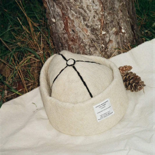 Snow White wool felt hat, crafted from 100% natural wool with minimalist elegance