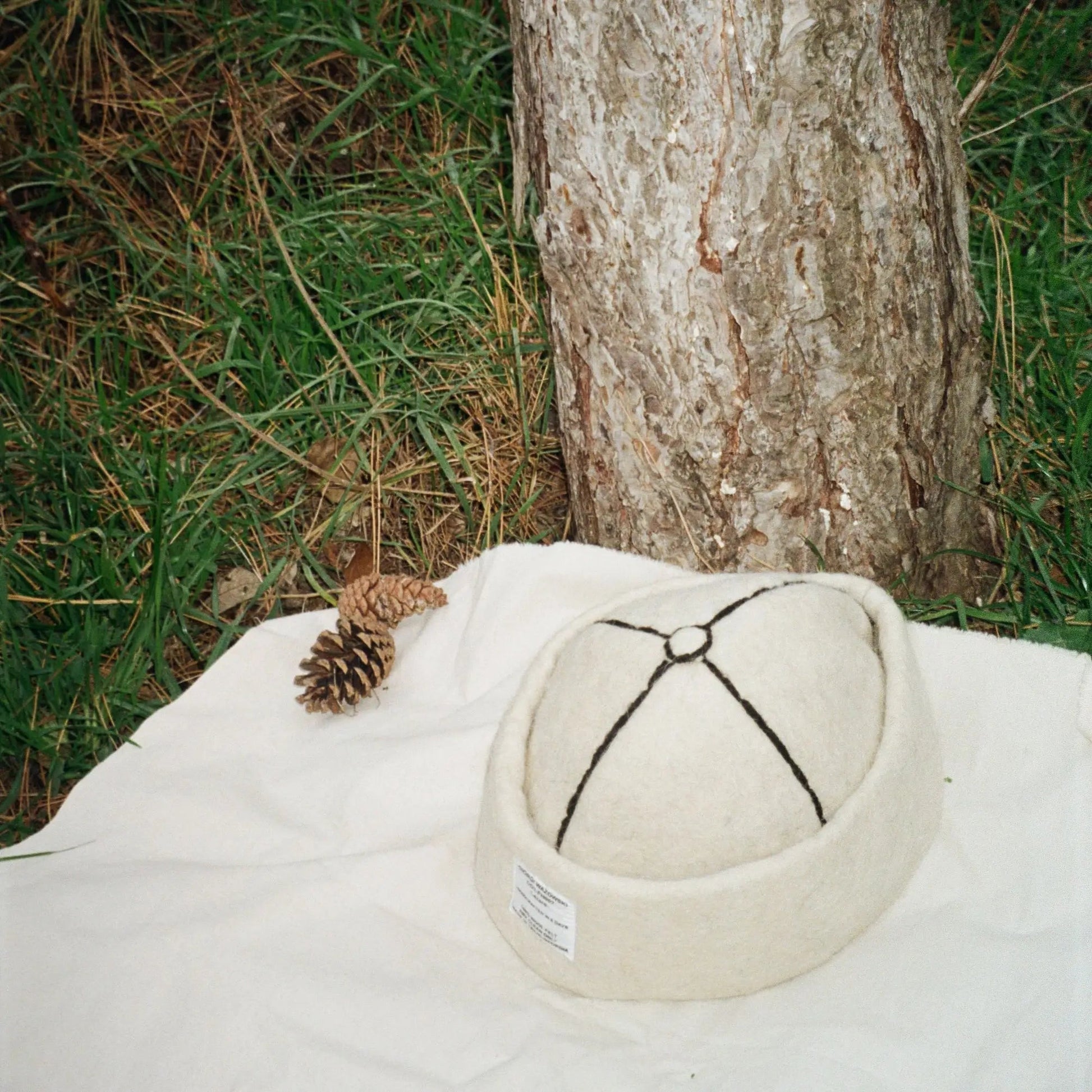 Snow White wool felt hat showcasing its classic design and black accents