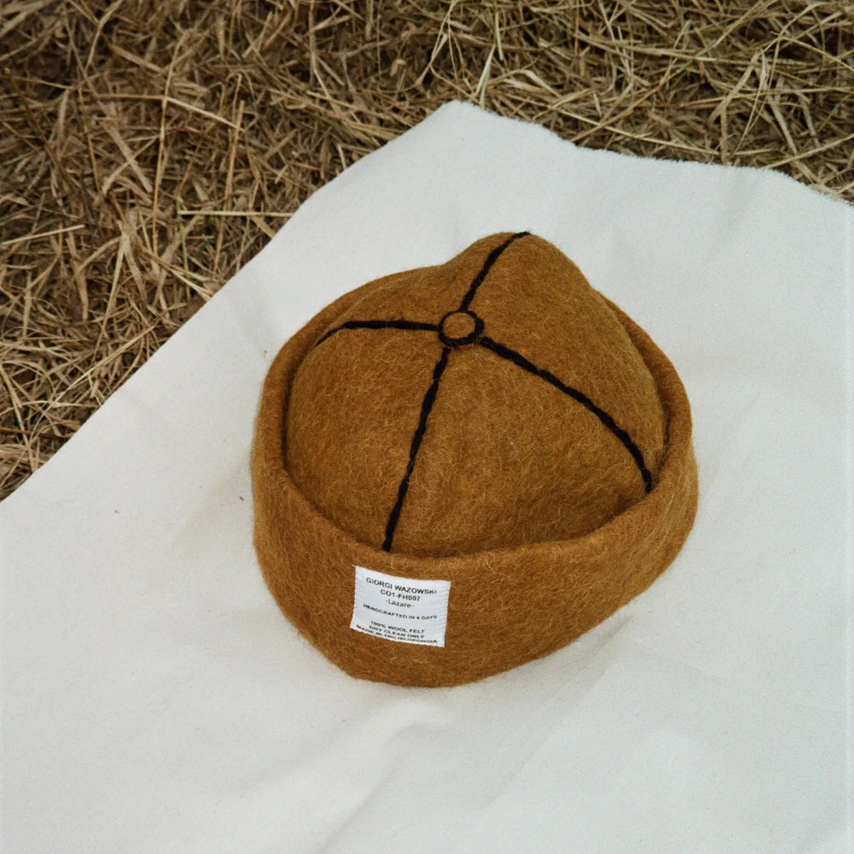 Detailed view of Tobacco hatâ€™s label and fine wool craftsmanship