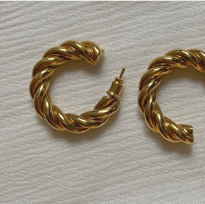 NURBANU twisted hoop earrings in recycled gold-plated brass, blending bold texture with lightweight elegance.