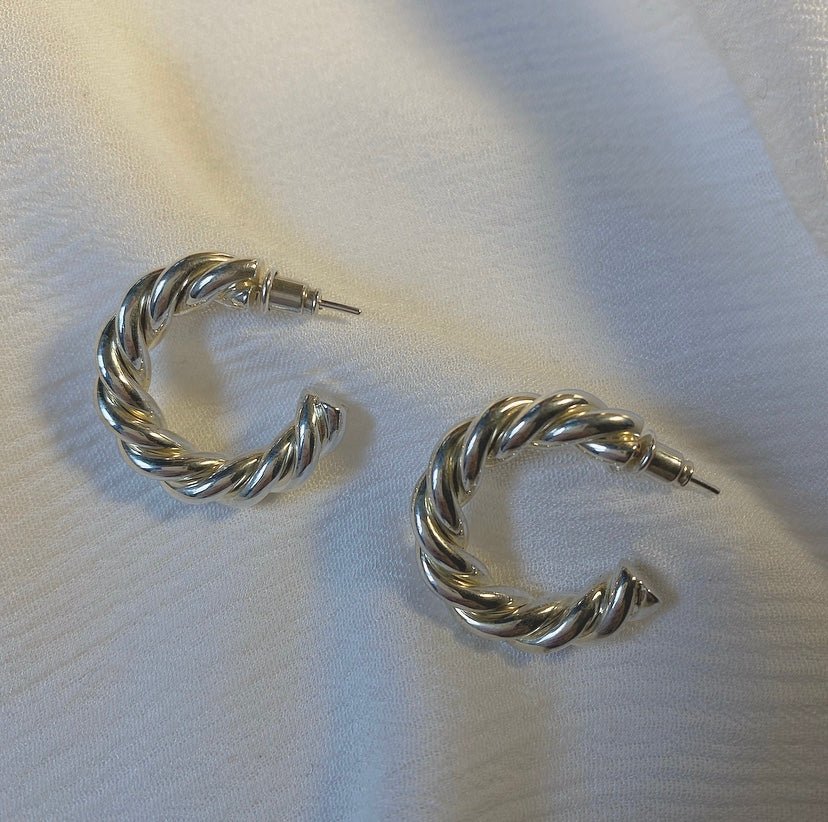 URBANU twisted sterling silver hoop earrings, blending minimalist texture with lightweight everyday elegance. Design by Giorgi Wazowski